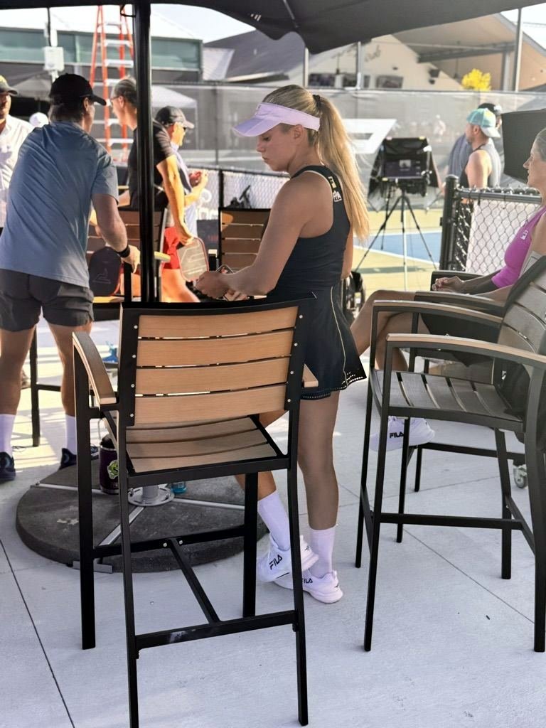 Player preparing her paddle at The Fort pickleball photo shoot