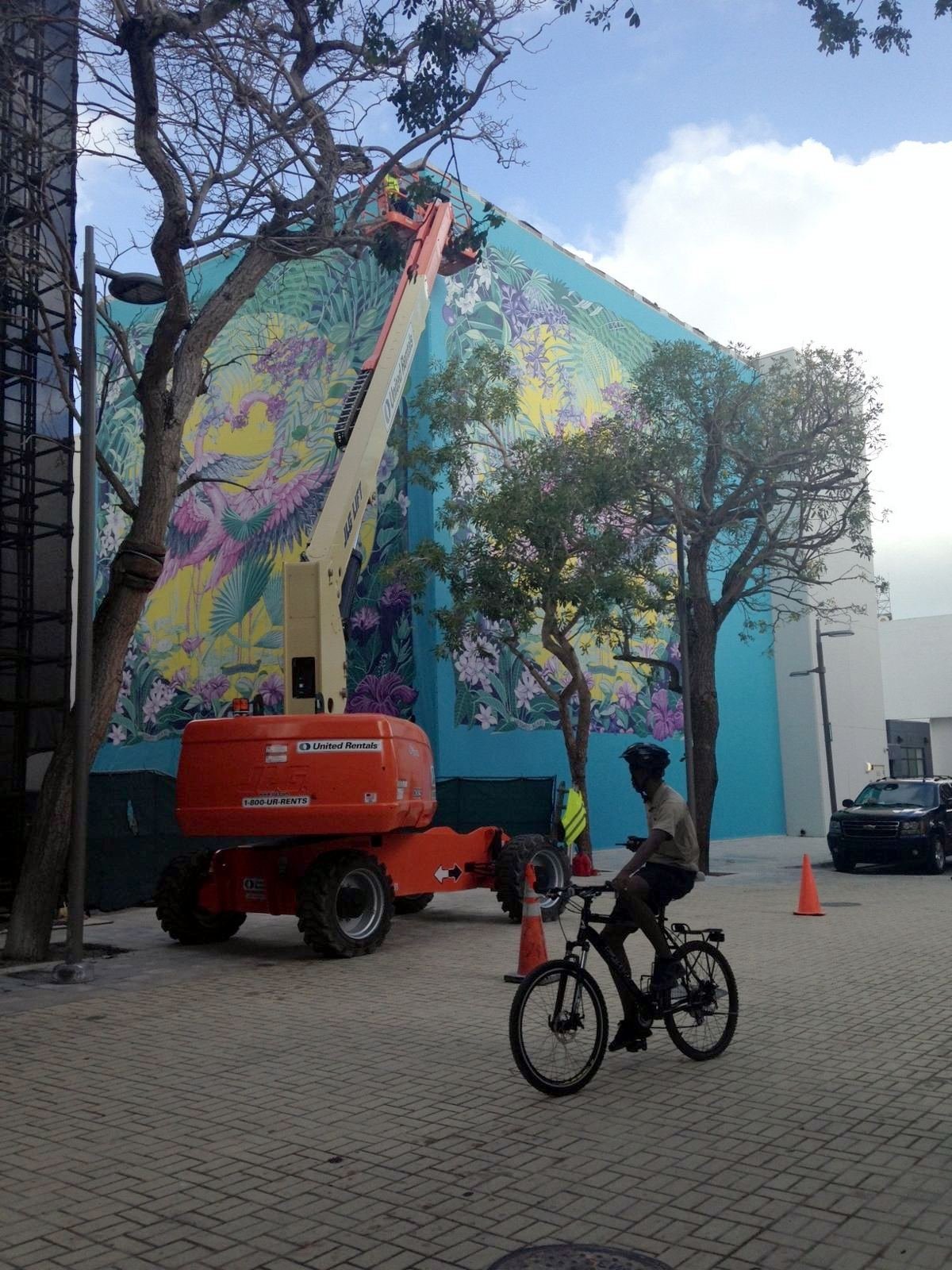 A tropical mural, installed by boom lift